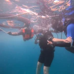 Snorkellers in life jackets with the guide in the water, snorkelling in Havelock Island