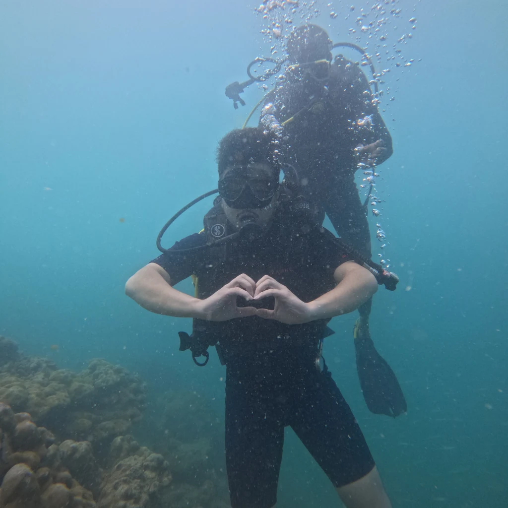 Diver making a heart sign underwater on a boat dive in Havelock