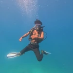 Diver in blue water with fins out, Nitrox course in Havelock, Andaman