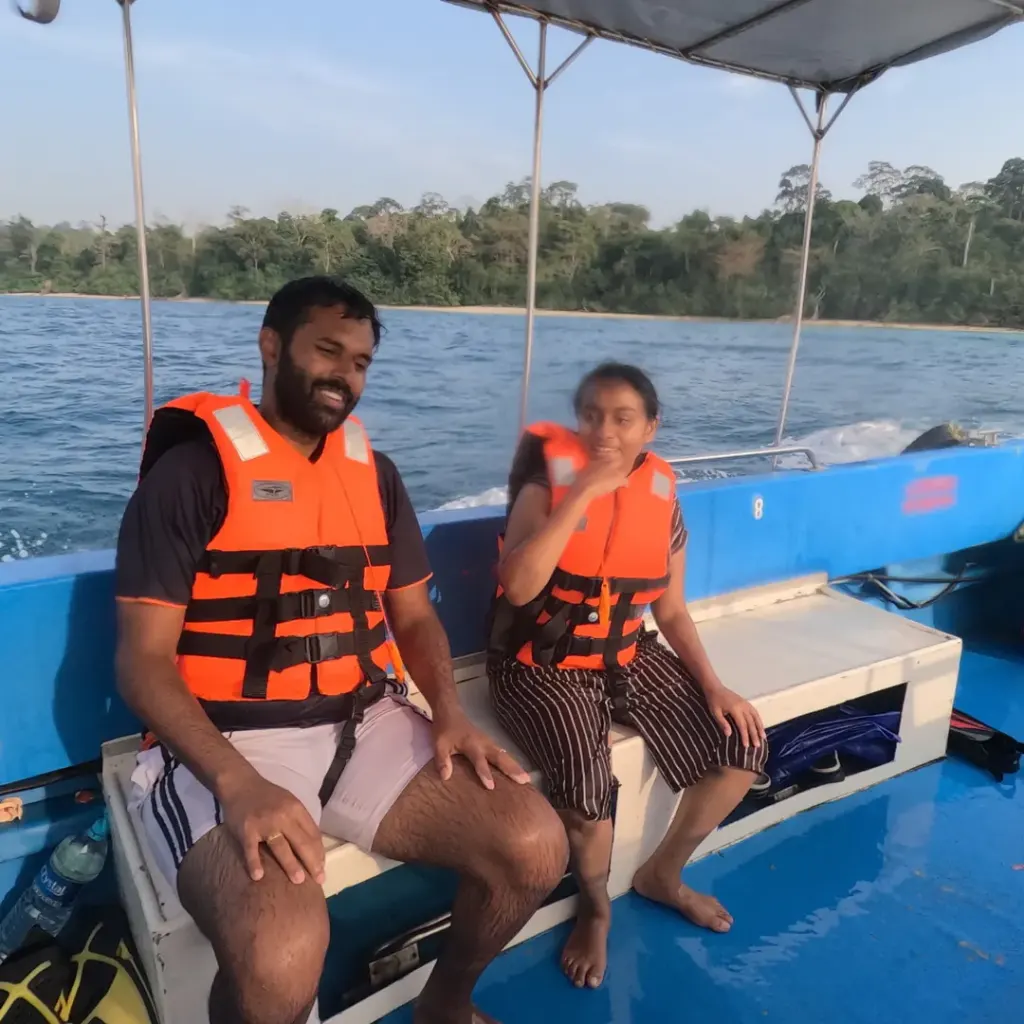 Couple in life jackets on the boat, snorkelling in Havelock Island