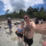 Couple taking a selfie on a rocky beach, island hopping from Havelock