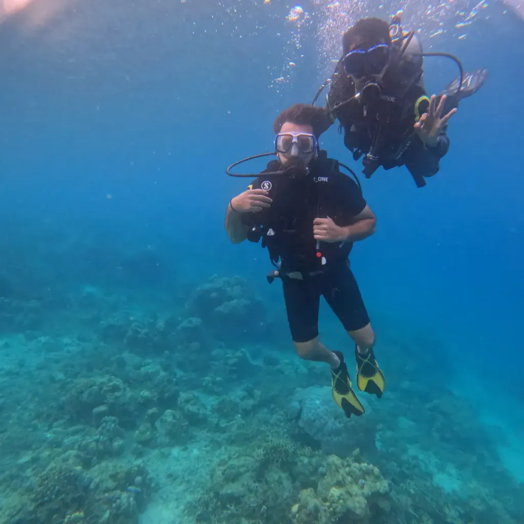 Diver making a hand sign with the instructor right behind, Juvi's scuba diving, Havelock Island