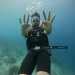 Diver showing two OK signs close to the camera, Juvi's scuba diving, Havelock Island
