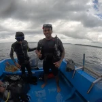 Two people in wetsuits standing on the dive boat, Nitrox course in Havelock, Andaman