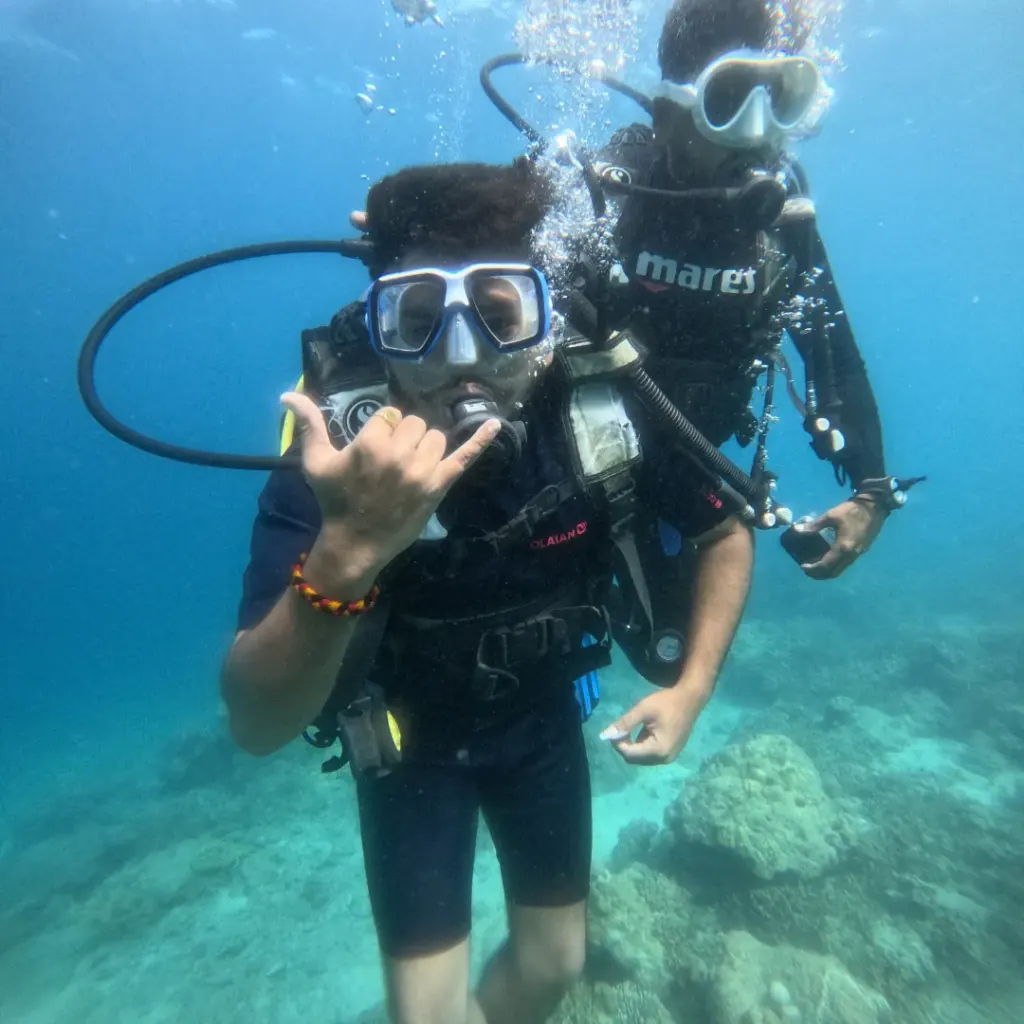 Diver making a shaka sign with the instructor close behind, Juvi's scuba diving, Havelock Island