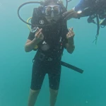Diver making hand signs in blue-green water, RAID Advanced 35 course in Havelock, Andaman