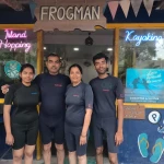 Guests in wetsuits in front of the Frogman dive shop, RAID Divemaster course in Havelock, Andaman