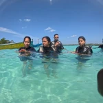 Group of guests in scuba gear in shallow water, RAID Divemaster course in Havelock, Andaman