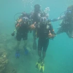 Group of three divers giving thumbs up, RAID Master Rescue Diver course in Havelock, Andaman