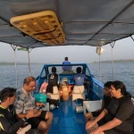 Guests seated on the boat heading out to sea, island hopping from Havelock