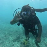 Diver making a hand sign close to the camera, scuba refresher in Havelock Island
