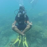 Diver hovering cross-legged above the reef, scuba refresher in Havelock Island