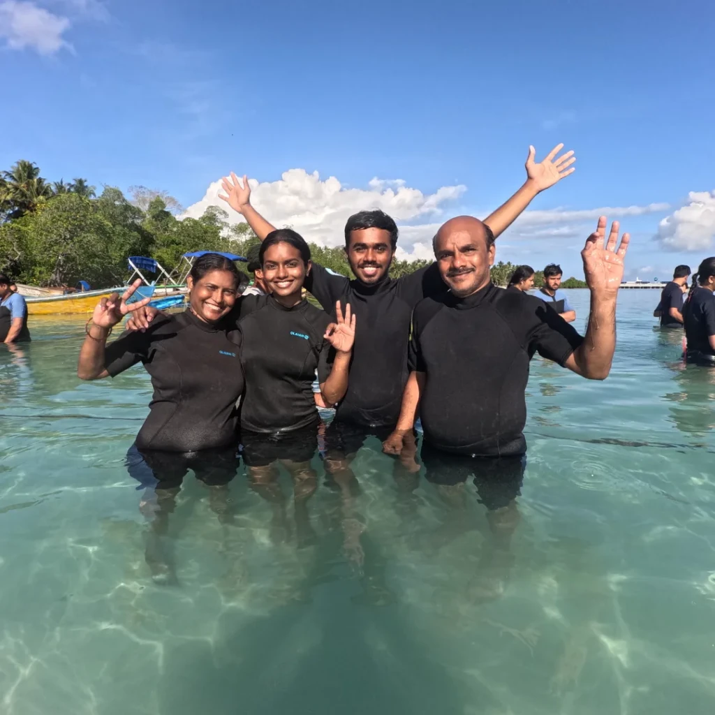 Shore dive in Andaman - group walking in from the beach at Havelock Island