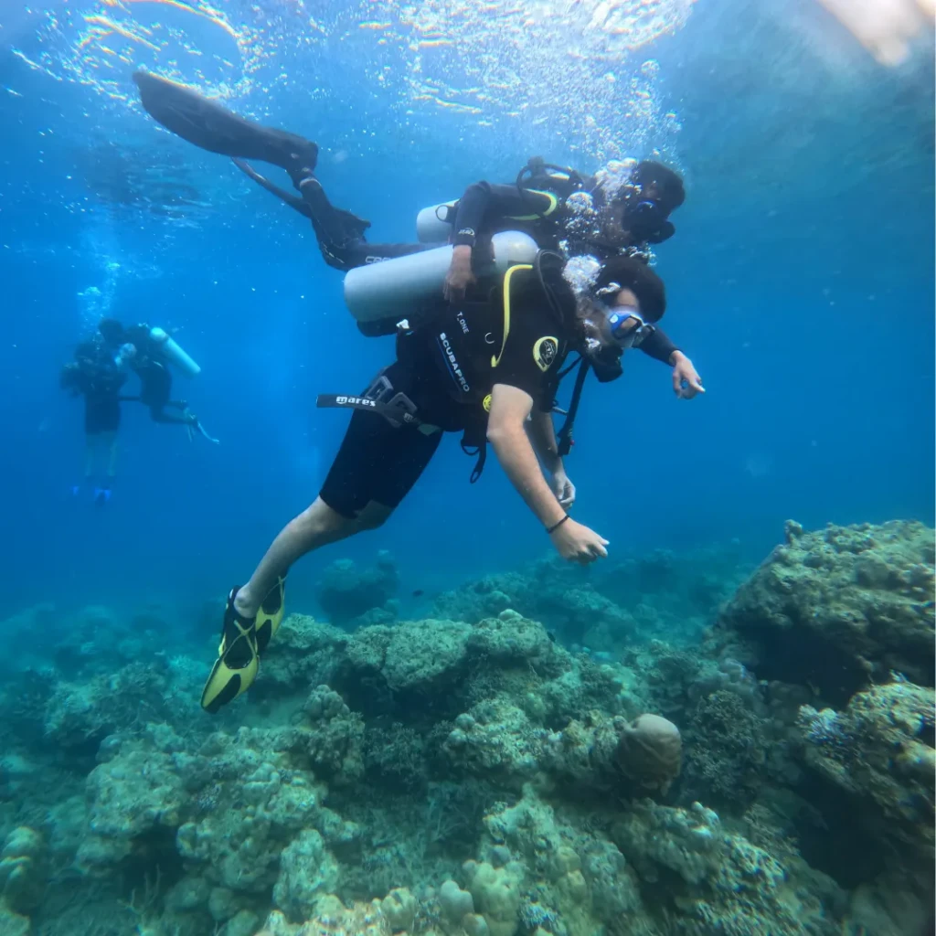 Instructor guiding a diver on a shore dive in Havelock, Andaman
