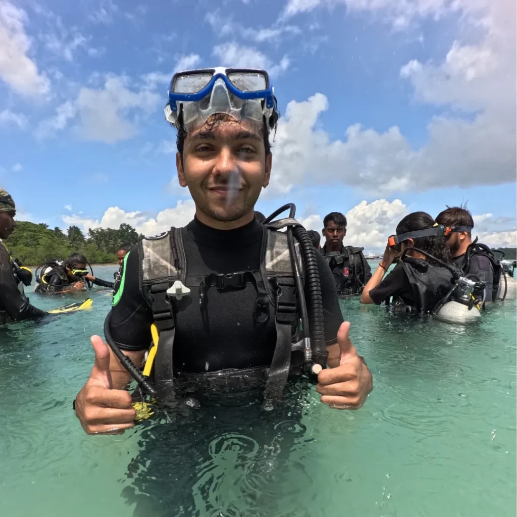 Shore scuba diving in Andaman - diver giving a thumbs up before the dive at Havelock