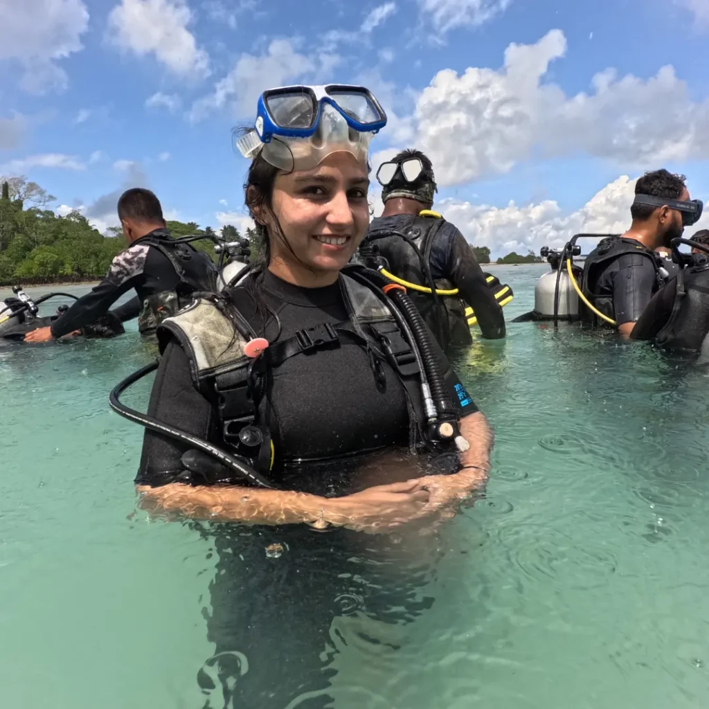 Shore scuba diving in Andaman - diver geared up in waist-deep water, no boat ride needed