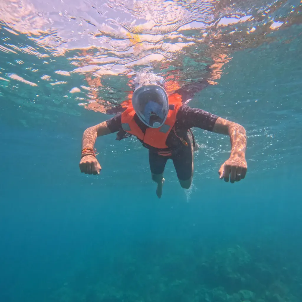 Snorkeller in a full-face mask swimming, snorkelling in Havelock Island