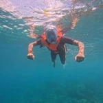 Snorkeller in a full-face mask swimming, snorkelling in Havelock Island
