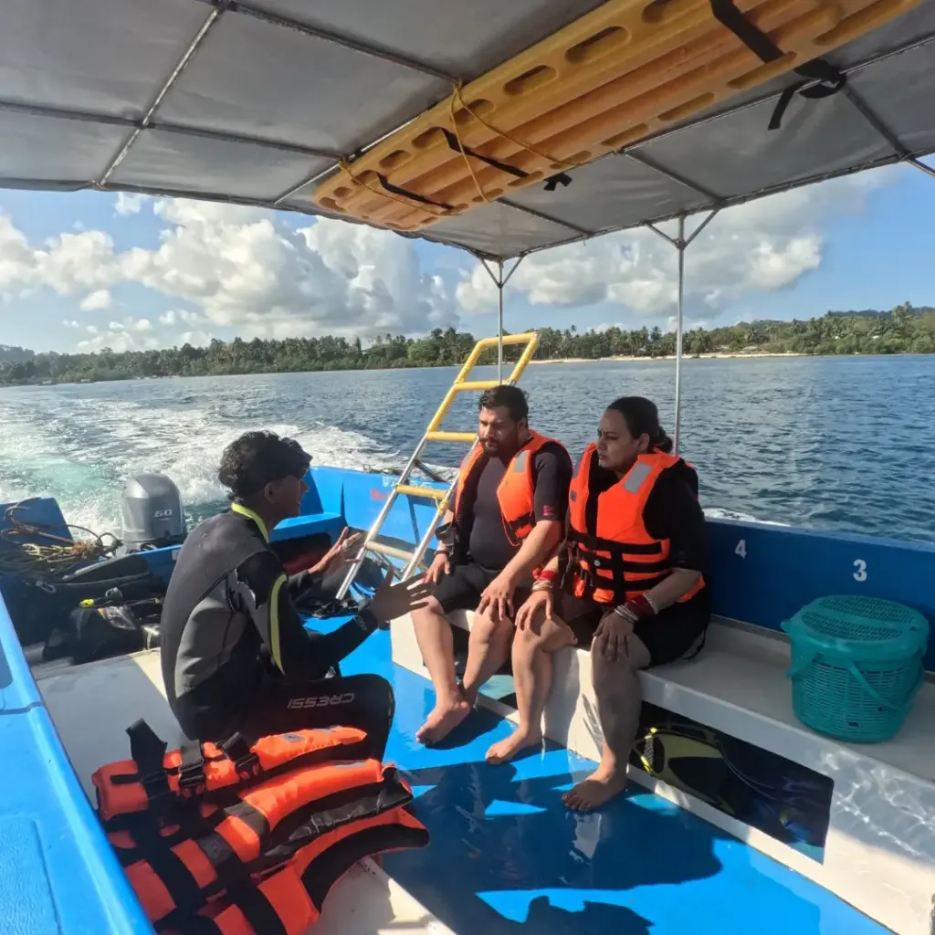 Guests in life jackets on the dive boat with the crew, The Slope scuba diving, Havelock Island