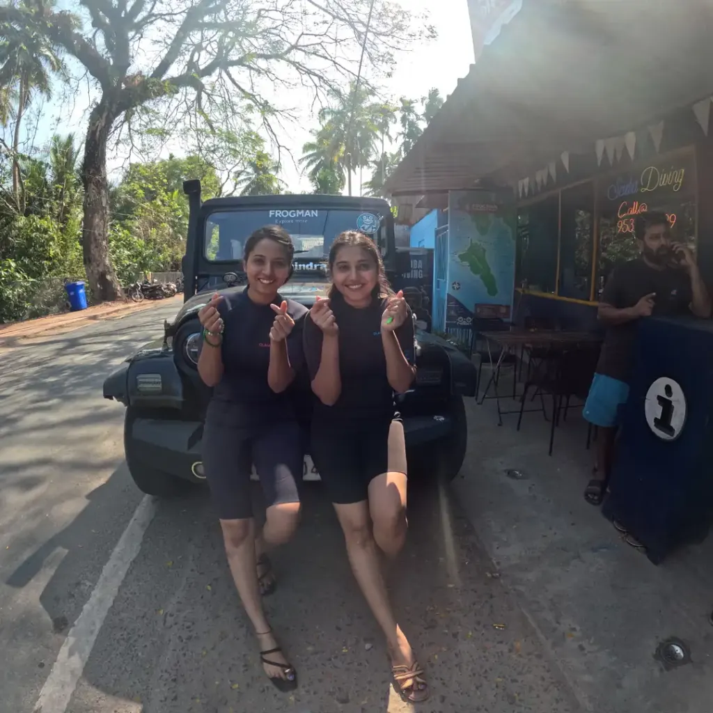 Two guests by the Frogman jeep outside the dive shop, Zero to Hero internship in Havelock, Andaman