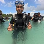 Guest in scuba gear giving thumbs up in shallow water, Zero to Hero internship in Havelock, Andaman