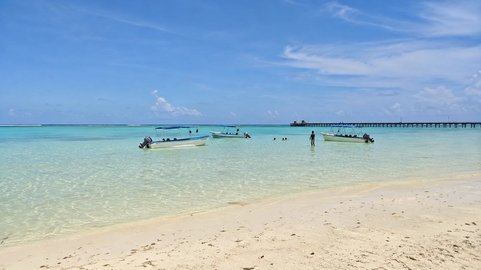 Shallow lagoon with boats at Bharatpur Beach, Neil Island