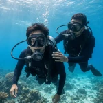 First-time scuba diver with instructor on a beginner dive at Havelock Island, Andaman