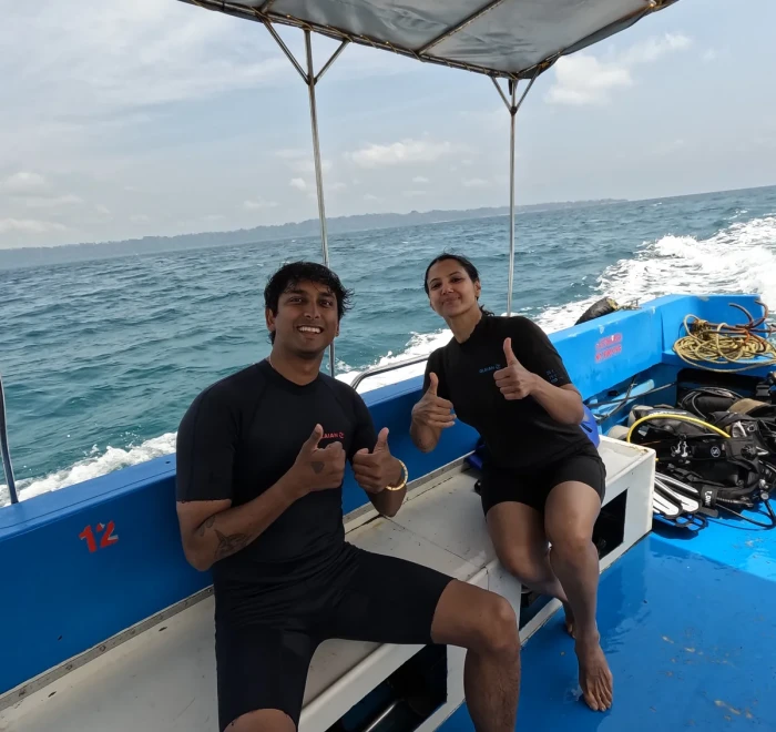 Couple on the dive boat heading out to the dive site