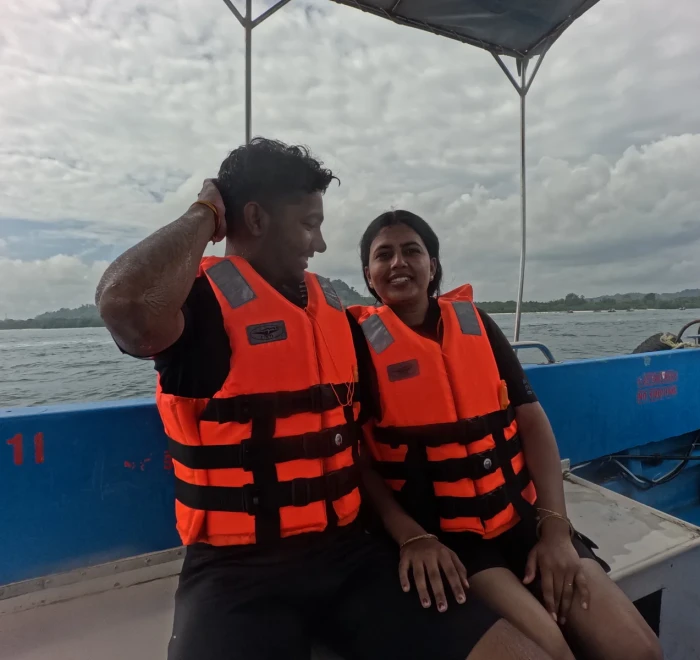 Couple in life jackets sitting on the dive boat