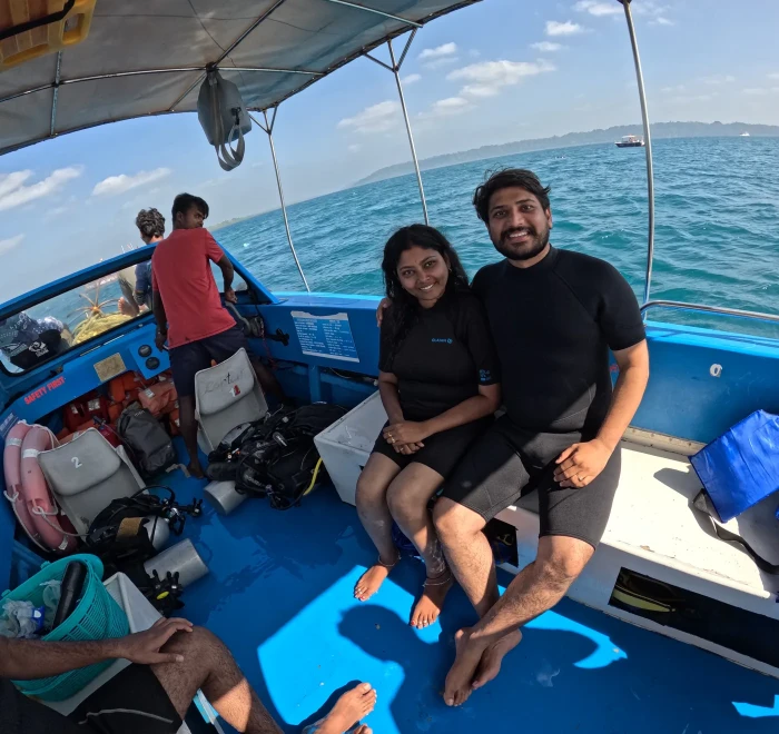 Couple sitting on the dive boat between dives