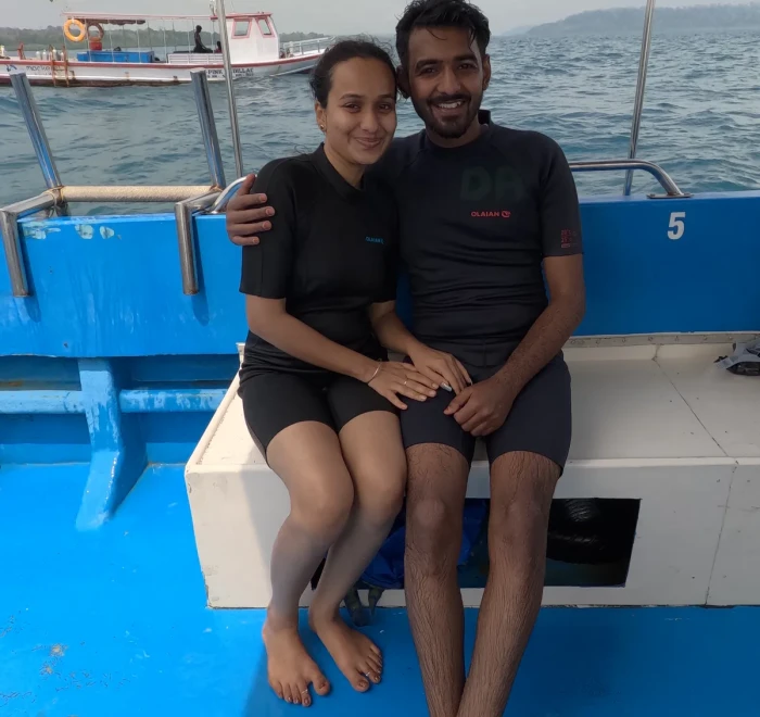 Couple sitting on the dive boat after their dive