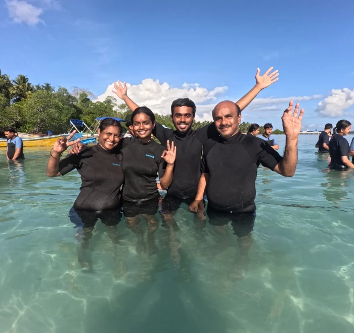 Dive group waving in the shallows at Havelock