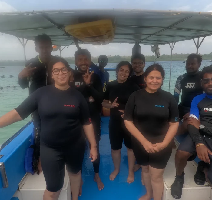 Dive group in wetsuits on the boat at Havelock Island