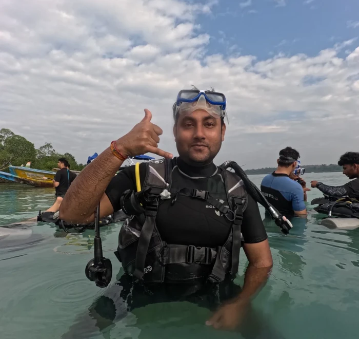 Diver in full scuba gear standing chest deep, ready for Havelock Island scuba diving