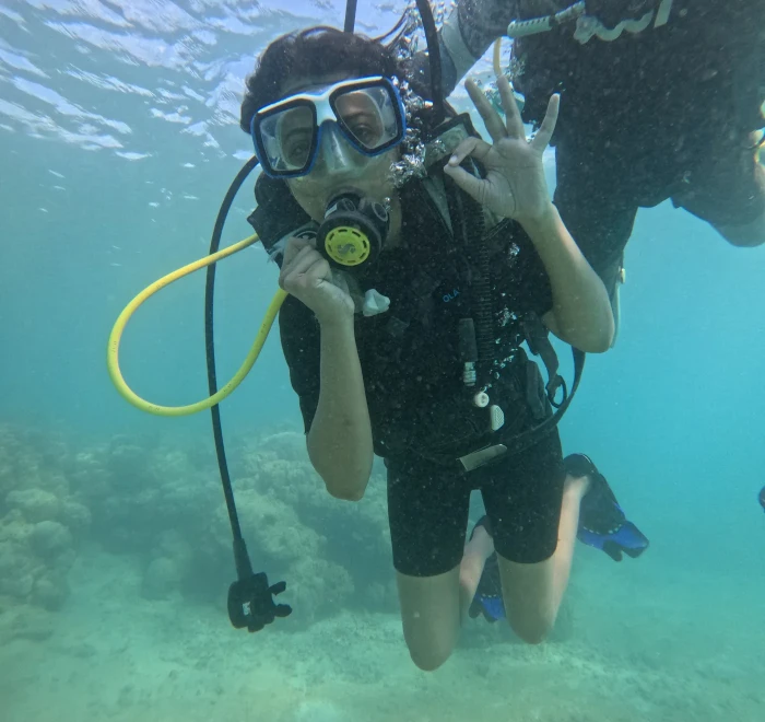 Diver giving the OK signal at the surface before descending