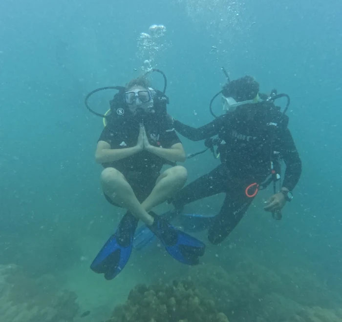 Diver sitting cross-legged on the bottom during a skills session
