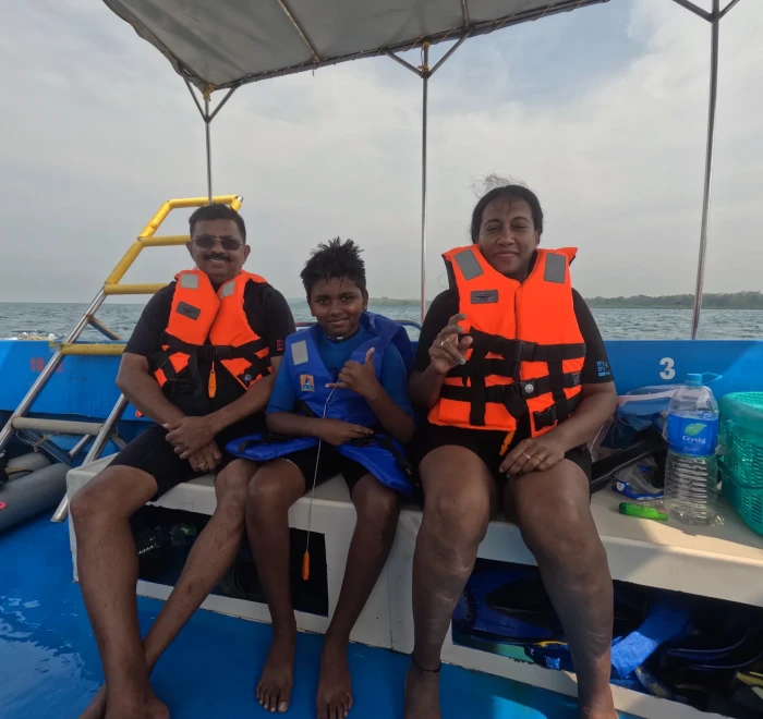 Family in life jackets on the dive boat at Havelock Island