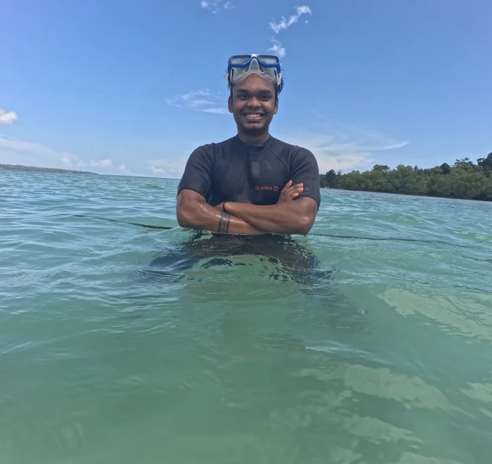 Guest standing in the shallows before his dive