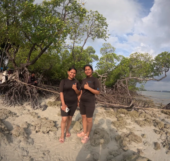 Guests on the beach beside the mangroves at Havelock