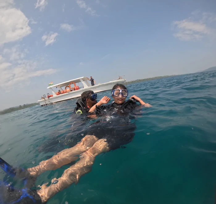 Guests floating at the surface beside the dive boat