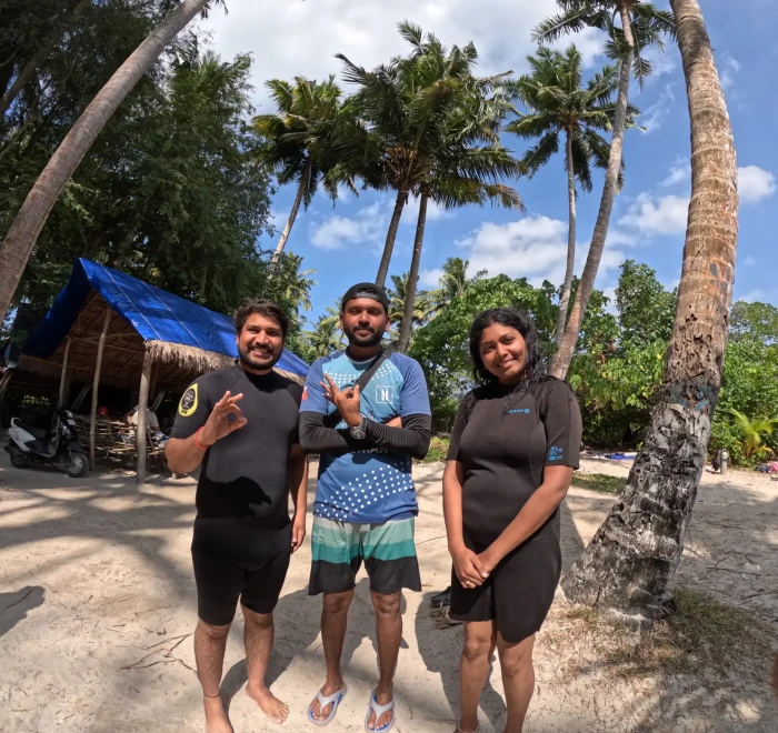 Guests at the Frogman dive centre under the palms at Havelock