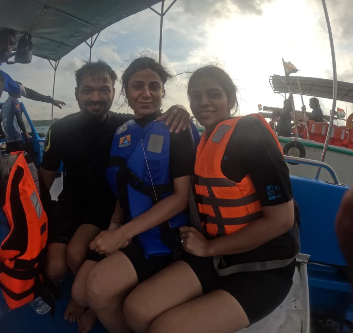 Guests in life jackets on the dive boat at sunset