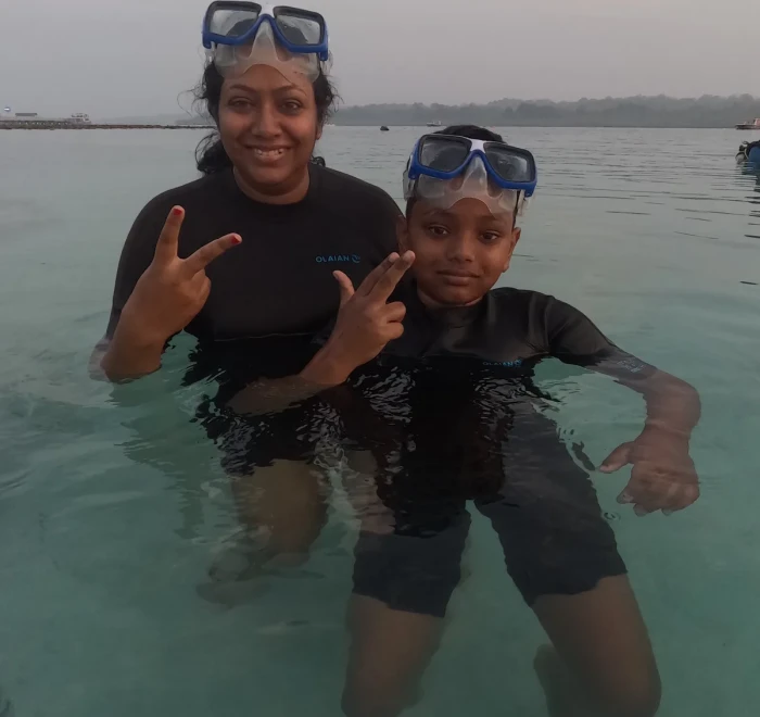 Mother and child in the shallows before a try scuba session at Havelock