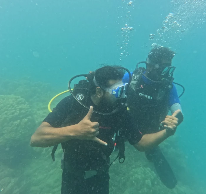 Two divers giving thumbs up after scuba diving in Havelock